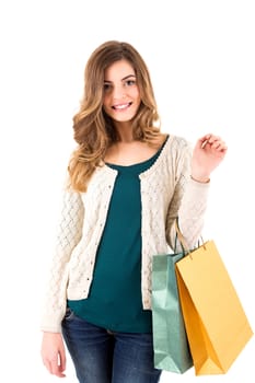 Beautiful woman holding shopping bags over white backgroung