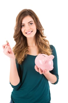 Casual woman looking to save money in a piggy bank