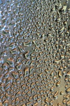 Water drops on metallic surface with color REFLECTION