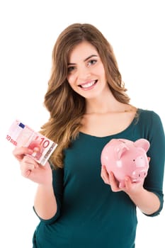 Casual woman looking to save money in a piggy bank