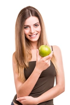 Portrait of a young woman eating green apple