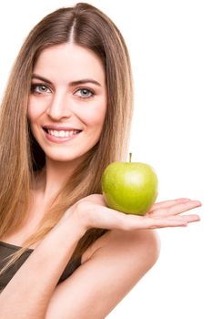 Portrait of a young woman eating green apple