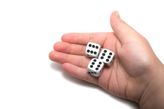 Hand holding three dices on white background
