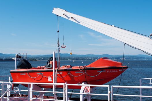 Lifeboat hanging a deck of cruise ship