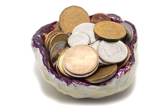 Tidy sundries tray vide-poche with Canadian coins inside, focus on one dollar coin