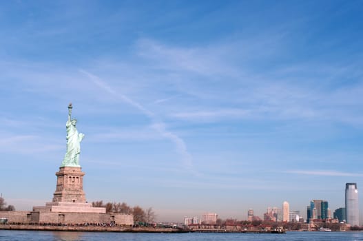 Liberty statue in Manhattan, NY, USA during a sunny day