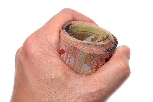 Hand holding a roll of 50 dollars Canadian 