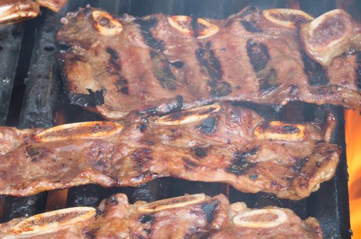 Korean short ribs grilled on a barbecue