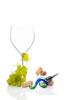 Empty wineglass with green grapes isolated on white background. Luxurious wine background. 