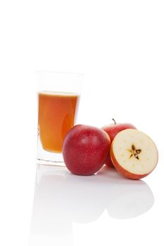 Fresh apple juice and apple isolated on white background with reflection. Healthy summer fruit drink.