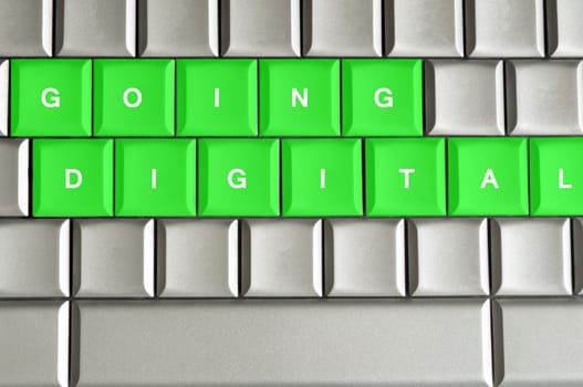 Going Digital spelled on a silver metallic keyboard