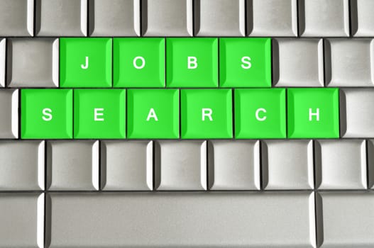 Jobs search spelled on a silver metallic keyboard