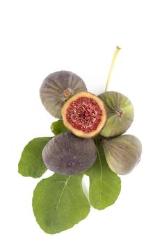 Fresh figs with green fig leaves isolated on white background. Healthy fig eating. 