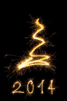 Merry christmas and happy new year 2014. Sparkling firework christmas and new year text on black background. Minimal abstract artistic style.