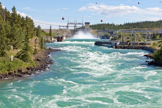 Violent white water in spillway of hydro-electric power plant of the small scale hydro station at Whitehorse, Yukon Territory, Canada