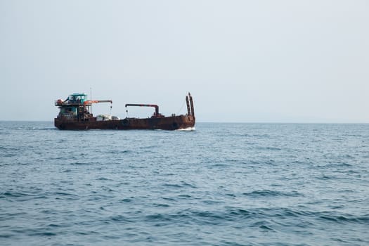large cargo ship. Was sailing in the sea. To Delivery to the island.