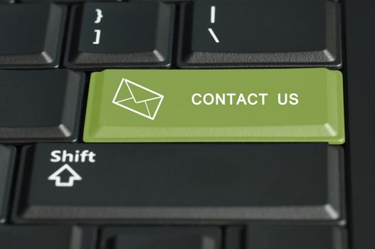 Concept of contact us call to  action. The focus is on the enter key with the shift button on the bottom