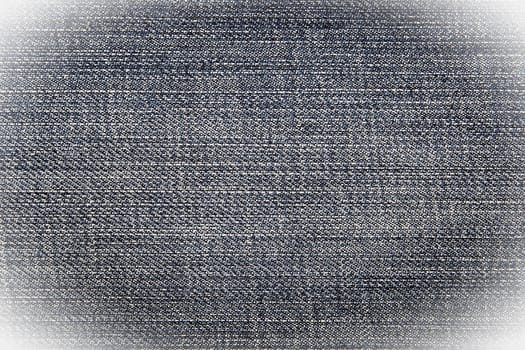 Navy-blue jeans wiht vignette, a textile background