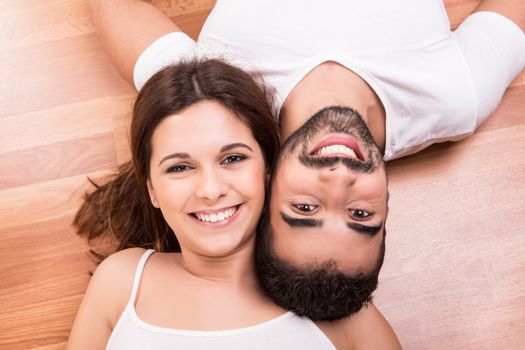 Love Couple at home relaxing on the floor