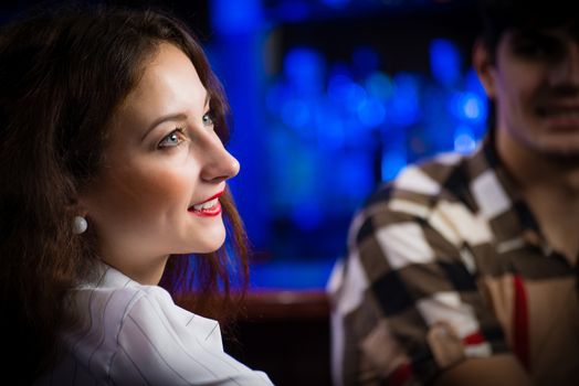 close-up portrait of a young woman in a bar