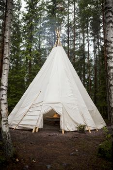 Teepee with a bonfire in the forest