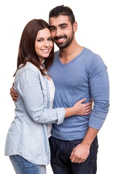 Young love couple hugging over white background