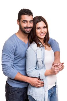 Young love couple hugging over white background