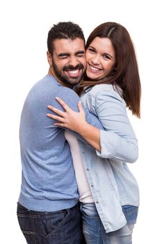 Young love couple hugging over white background