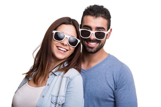 Portrait of a funny couple wearing sunglasses 