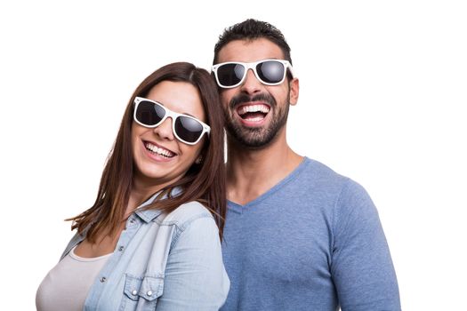 Portrait of a funny couple wearing sunglasses 