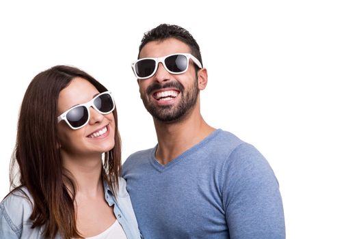 Portrait of a funny couple wearing sunglasses 