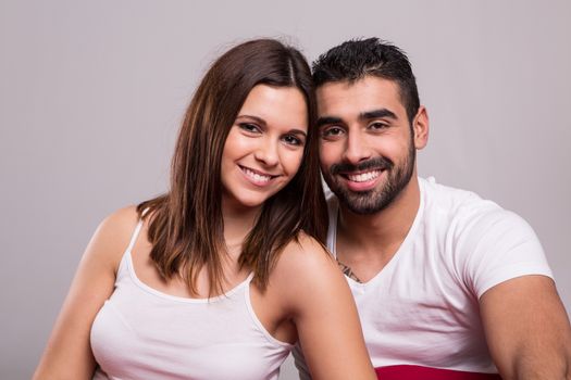 Young love couple relaxing together in bed 