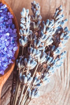 Lavender bunch and sea salt on the wooden table