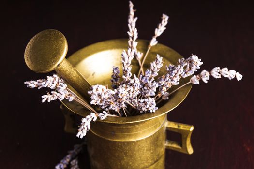 Dry lavender bunch in the copper mortar