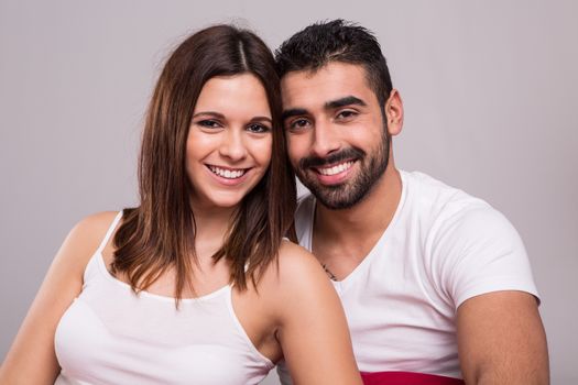 Young love couple relaxing together in bed 