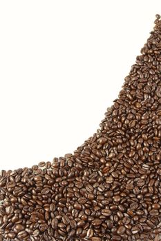 Closeup of coffee beans on plain background. Copy space