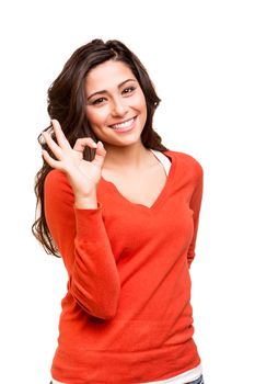 Beautiful young woman showing Ok sign