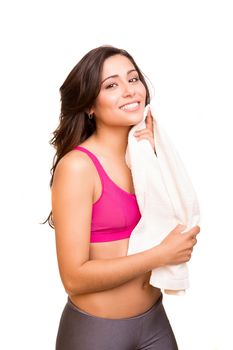 Attractive fitness woman posing with gym towel 