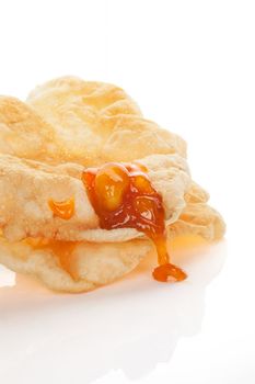 Delicious papadum with mango chutney isolated on white background. Culinary indian eating.