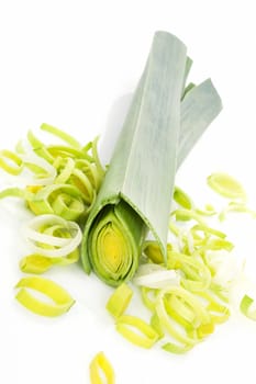 Sliced leek isolated on white background. Luxurious healthy vegetable background.