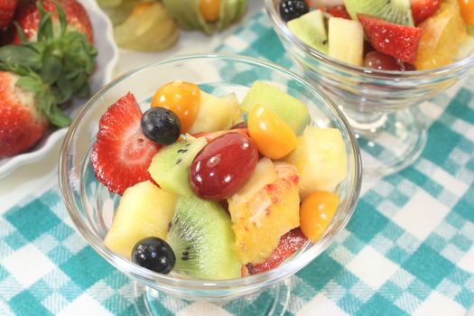 Fruit salad in a bowl on checkered napkin