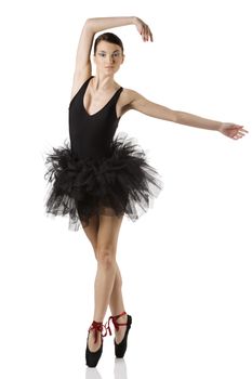 classic dancer with black dress and shoes on white background dancing on pointe