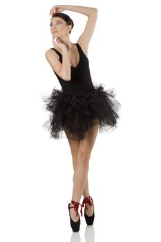 pretty girl classic dancer with black dress and shoes dancing on pointe