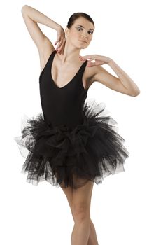classic dancer with black dress and shoes on white background taking ballet pose