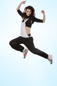 stunning brunette dancer in modern style flying in acrobatic pose