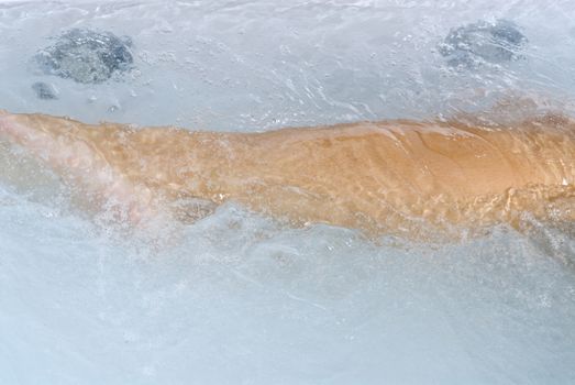 close up of woman body inside a whirlpool