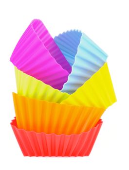 Stack of Silicone Rainbow Colored Cupcake Molds In a Row isolated on white background