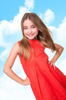 Portrait of funny lovely little girl over sky background