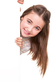 Cute little girl behind a white board