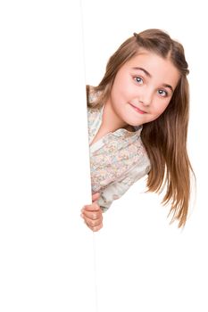 Cute little girl behind a white board